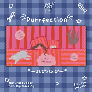 May include: A rectangular desk mat measuring 31.5 inches by 15.5 inches with a pink and red striped pattern. It features illustrations of a person in bed, cats, and text reading Purrfection, Cat Nap Club, Lets Just Stay In Bed, and Purr & Repeat.