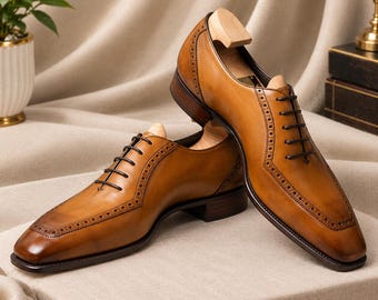 Calzature Oxford da uomo marroni, realizzate a mano.