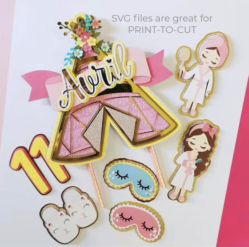 May include: A pink and gold printable cake topper set with a tent, flowers, a girl in a robe, and the name "Avril" on a pink ribbon. The set also includes a number 11, two pairs of eye masks, and a pair of slippers.