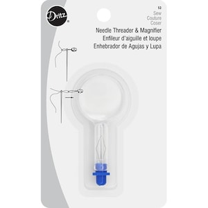 May include: A clear plastic needle threader with a magnifying glass on top. The threader has a blue plastic handle and a small metal needle. The packaging shows instructions for using the threader.