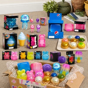 One Mystery Sensory Squeeze Toy met kleurrijk fruit en glitterontwerpen