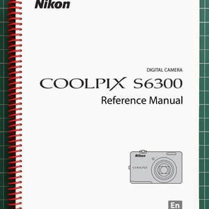 May include: A white Nikon COOLPIX S6300 digital camera reference manual with black text and a red spiral binding. The cover features the Nikon logo, the model name, and a small line drawing of the camera with the letters En in a gray box.