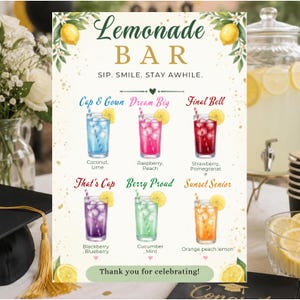 May include: A rectangular Lemonade Bar sign featuring watercolor illustrations of six colorful drinks with names like Cap & Gown, Dream Big, Final Bell, That's Cap, Berry Proud, and Sunset Senior, decorated with lemon and floral accents.