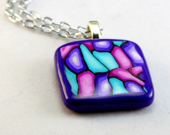 Purple, pink, and turquoise "stained-glass" polymer clay pendant