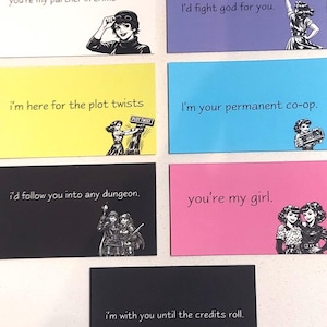 May include: A collection of seven rectangular greeting cards in various colors, each featuring a black and white illustration and text. The cards include phrases like you're my partner in crime, I'd fight god for you, i'm here for the plot twists, I'm your permanent co-op, I'd follow you into any dungeon, you're my girl, and i'm with you until the credits roll.