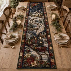 May include: A long rectangular table runner featuring a detailed winter scene with a steam locomotive traveling on tracks toward a snow-covered house. The design includes poinsettias, pine branches, and a dark blue background with snowflakes.