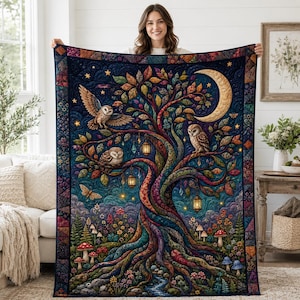 May include: A rectangular quilt featuring a vibrant, detailed illustration of a large tree with colorful leaves, three owls, a crescent moon, and hanging lanterns. The scene includes a forest floor with mushrooms and flowers.