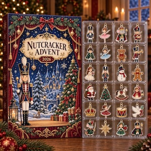 May include: A Nutcracker Advent 2026 calendar box featuring a winter scene with a nutcracker soldier, a castle, and a Christmas tree, alongside a clear plastic tray containing twenty-four assorted Christmas-themed metal charms and ornaments.