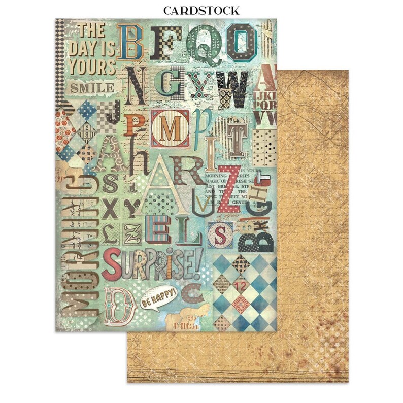 May include: Cardstock paper with a collage design featuring large, colorful letters and phrases like "The Day is Yours" and "Surprise!". The background is a mix of patterns and textures, with a separate sheet of textured, tan paper.