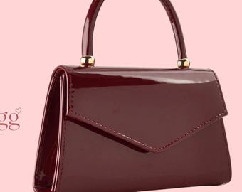Burgundy Glossy Top Handle Bag with Envelope Flap and Gold Tone Hardware