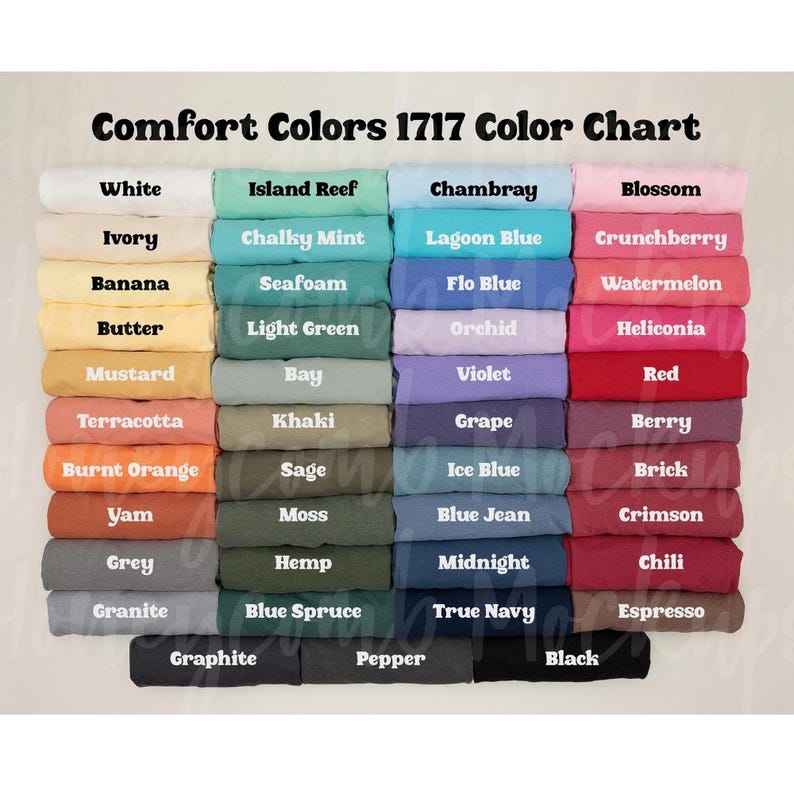 May include: A Comfort Colors 1717 color chart displaying a grid of folded t-shirts in various shades. The text at the top reads Comfort Colors 1717 Color Chart. The colors include white, ivory, banana, butter, mustard, terracotta, orange, yam, grey, granite, and black.