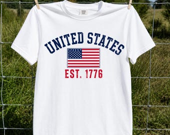 Camiseta con la bandera de Estados Unidos, camiseta vintage americana, camiseta retro con estampado patriótico, USA EST 1776, ropa de orgullo nacional.