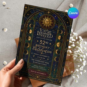 May include: A rectangular invitation card featuring a dark blue and gold celestial design with moon phases, a sun icon, and stars. The text reads: YOU'RE INVITED, JOIN OLIVIA FOR HER 32ND BIRTHDAY CELEBRATION, FRIDAY, NOVEMBER 21 AT 8:30 PM, THE STARLIGHT HALL.