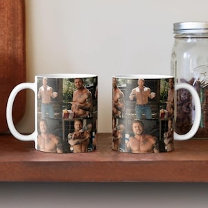 May include: Two white ceramic mugs featuring a photo collage of a shirtless person with tattoos on their chest and arms. The images show the person in various poses, including standing in blue jeans and looking toward the camera in outdoor settings.