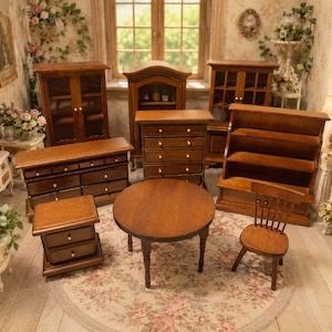 May include: A collection of miniature wooden furniture including a round table, a spindle-back chair, a tall chest of drawers, a wide dresser, a nightstand, and three different cabinets with glass doors, all featuring a dark brown wood finish.