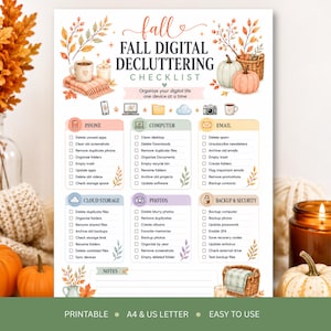 May include: A Fall Digital Decluttering Checklist printed on white paper with autumn-themed illustrations of pumpkins, leaves, and candles. The document features six categorized sections for organizing digital files, including phone, computer, email, cloud storage, photos, and backup security, with checkboxes for each task.