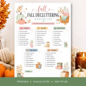 May include: A fall decluttering checklist printable featuring sections for closet, pantry, home office, kids room, and storage. The document includes watercolor illustrations of pumpkins, baskets, and a candle, with text prompts for organizing home spaces.