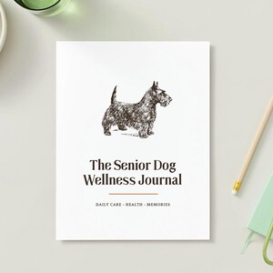 May include: A white journal titled The Senior Dog Wellness Journal with a black ink illustration of a Scottish Terrier. Below the title, the text reads DAILY CARE - HEALTH - MEMORIES. The cover features a clean design with a small orange horizontal line.