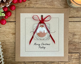 Frohe Weihnachten Pudding. Handgemachte Karte mit süßem Christmas Pudding Andenken aus geschmolzenem Glas für immer. Besondere einzigartige Weihnachtskarte.