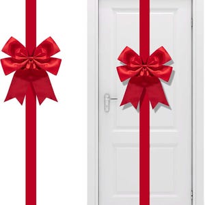 May include: A vibrant red satin ribbon featuring a large, pre-tied decorative bow. The long, vertical ribbon strip is designed to wrap around a door, creating a gift-wrapped appearance with the bow positioned centrally on the door's surface.