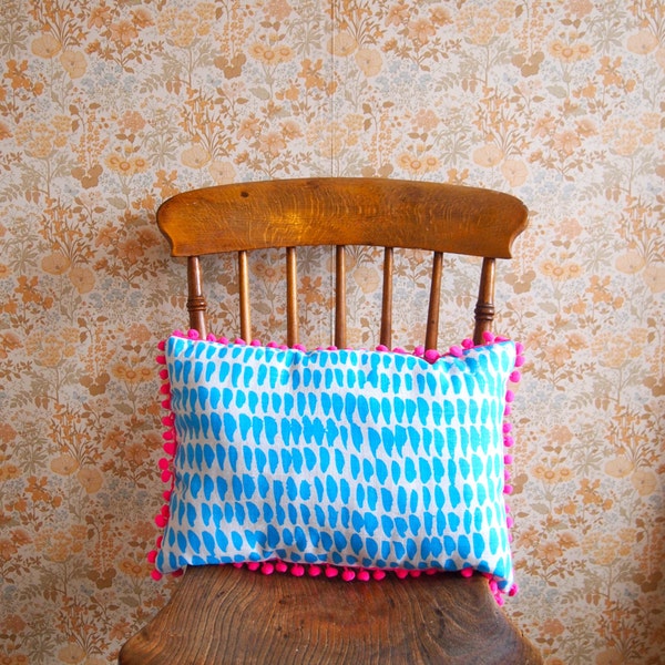 Neon Pink Pom Pom Cushion in Blue