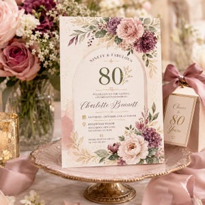 Könnte beinhalten: Eine rechteckige Einladungskarte mit einem Blumenbogen-Design aus rosa und violetten Pfingstrosen, grünen Blättern und goldenen Akzenten. Der Text lautet: NINETY & FABULOUS, 80, PLEASE JOIN US FOR A JOYFUL CELEBRATION HONORING Charlotte Bennett, SATURDAY, OCTOBER 11TH AT 3:00 PM, ROSEWOOD MANOR, 214 GARDEN VIEW LANE, SAVANNAH, GA 31401, KINDLY RSVP TO AMELIA AT (555) 201-4187.