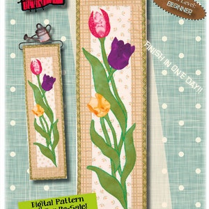 Pode incluir: Um padrão digital para um bloco de acolchoado de tulipas. O padrão é para um nível de habilidade iniciante e pode ser concluído em um dia. O bloco de acolchoado mede 15,24 cm por 55,88 cm. O padrão não é para revenda.