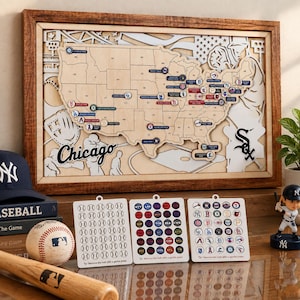 May include: A wooden framed wall art piece featuring a layered map of the United States with baseball stadium locations, accompanied by three sheets of circular team logo stickers, a baseball, a wooden bat, and a small baseball player figurine.