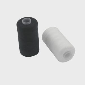 May include: Two cylindrical spools of sewing thread, one solid black and one solid white. Each spool features a central plastic core visible at the top and bottom, with the thread wound tightly around the exterior surface of the spool.