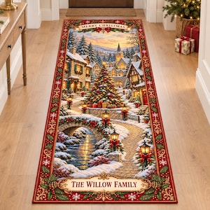 May include: A rectangular runner rug featuring a winter village scene with a decorated Christmas tree, stone bridge, and snow-covered houses. The border is red with holly and snowflakes. Text reads Merry Christmas and The Willow Family.