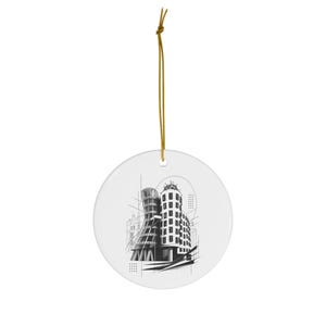 May include: A round white ceramic ornament featuring a black and white architectural illustration of a curved building. The design includes geometric lines and a dotted pattern. A thin gold string is attached to the top for hanging purposes.
