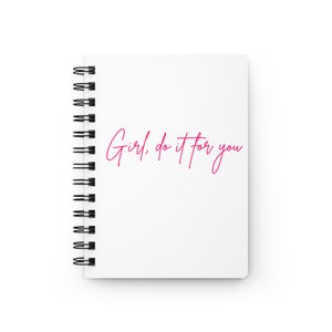 May include: A white spiral-bound notebook featuring the text Girl, do it for you in a magenta cursive script font. The notebook has a black metal wire binding along the left side and a clean, minimalist white cover design with centered text.