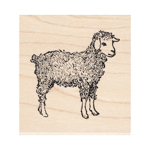 May include: A black and white line drawing of a sheep on a light brown wooden background.