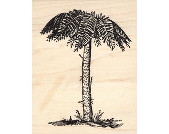 May include: Black and white line drawing of a palm tree on a light wood background.