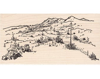 May include: A black and white line drawing of a desert landscape with a winding road leading to a mountain range in the distance.