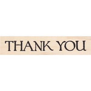 Może przedstawiać: Drewniana pieczątka z tekstem "THANK YOU" w czarnych literach.