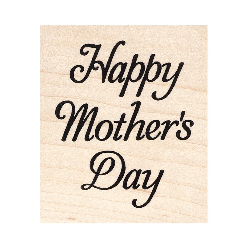 May include: A wooden stamp with the text "Happy Mother's Day" in a cursive font.