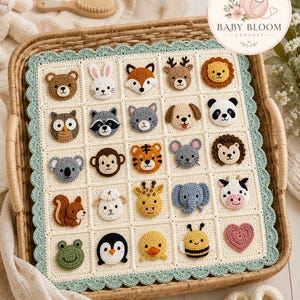 May include: A cream-colored crochet baby blanket featuring a grid of twenty-five squares, each decorated with a unique crocheted animal face or a heart. The blanket has a scalloped sage green border and is displayed inside a woven basket.