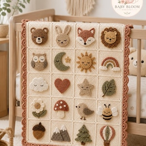 May include: A cream-coloured crochet blanket featuring a grid of twenty square patches, each displaying a unique 3D applique including animals, nature elements, and celestial shapes. The blanket is finished with a scalloped terracotta-coloured border.