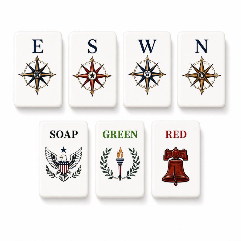 May include: Seven rectangular white tiles featuring illustrations. The top row shows four compass roses labeled E, S, W, and N. The bottom row displays an eagle with the word SOAP, a torch with the word GREEN, and a bell with the word RED.