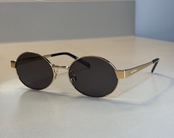 Saint Laurent SL 692 002 Sunglasses - oval brown lens, gold frame- unisex