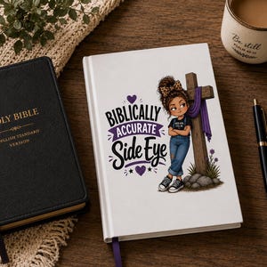 May include: A white notebook featuring a cartoon illustration of a person with a leopard print bow leaning against a wooden cross with purple fabric. The text reads "BIBLICALLY ACCURATE Side Eye" with purple hearts. A black Bible and a pen are nearby.