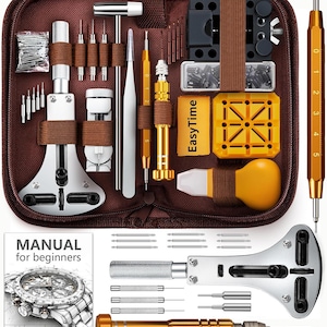 May include: A watch repair kit in a brown zippered case containing a metal case opener, gold-toned screwdrivers, tweezers, a hammer, a yellow plastic watch holder, a spring bar tool, and various pins. Includes a manual for beginners booklet.