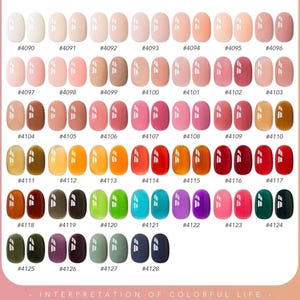 May include: A color chart displaying 39 pairs of oval nail polish swatches in various shades, ranging from white and nude to pink, red, orange, yellow, green, blue, purple, and black. Each swatch pair is labeled with a number from 4090 to 4128.