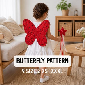May include: A white dress featuring red butterfly wings with black polka dots and a red star-shaped wand with white ribbons. The text on the image reads BUTTERFLY PATTERN and 9 SIZES: XS-XXXL. The garment is worn with white shoes.