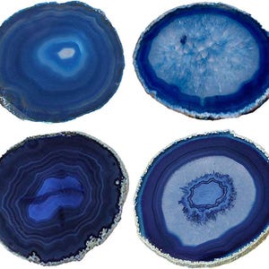 May include: Four circular agate slices in various shades of blue. Each slice features distinct concentric banding patterns, crystalline centers, and natural, rough-textured edges that are finished with a metallic silver-toned trim.