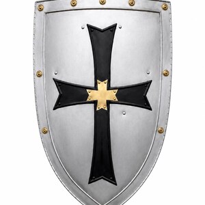 May include: A silver-colored heater shield featuring a prominent black cross emblem with a central gold-colored star-shaped accent. The shield is bordered by a metallic rim secured with evenly spaced gold-colored rivets along the outer edge.