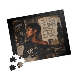 May include: A rectangular jigsaw puzzle featuring a collage design with a person in profile, city skyline, and train. Text reads: "All things are working for my good, because I am called according to God's purpose. Romans 8:28", "Southside Heart", and "XR Muse".