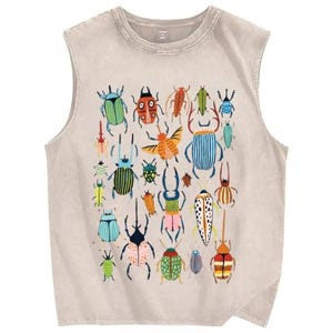 May include: A beige sleeveless shirt featuring a graphic print of various colorful beetles and insects in shades of blue, green, orange, and red. The garment has a crew neckline and a distressed, washed-out fabric texture throughout the entire piece.