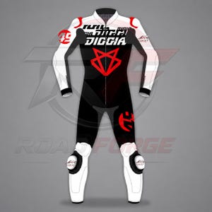 May include: A black and white motorcycle racing suit featuring red accents, a central zipper, and a red geometric fox-like logo on the chest. The suit displays the text DIGGIA, the number 49, and branding logos on the shoulders, knees, and chest area.